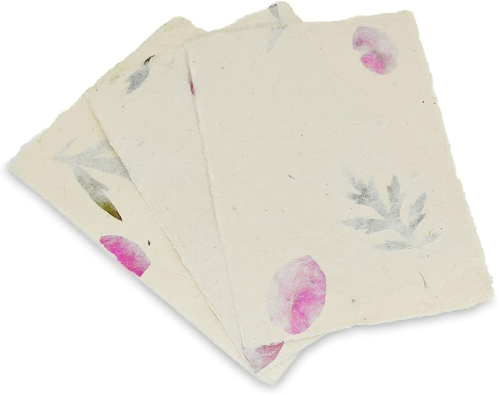 Handmade Lokta Paper Sheets with bougainvillea flower petals and titepati leaves.