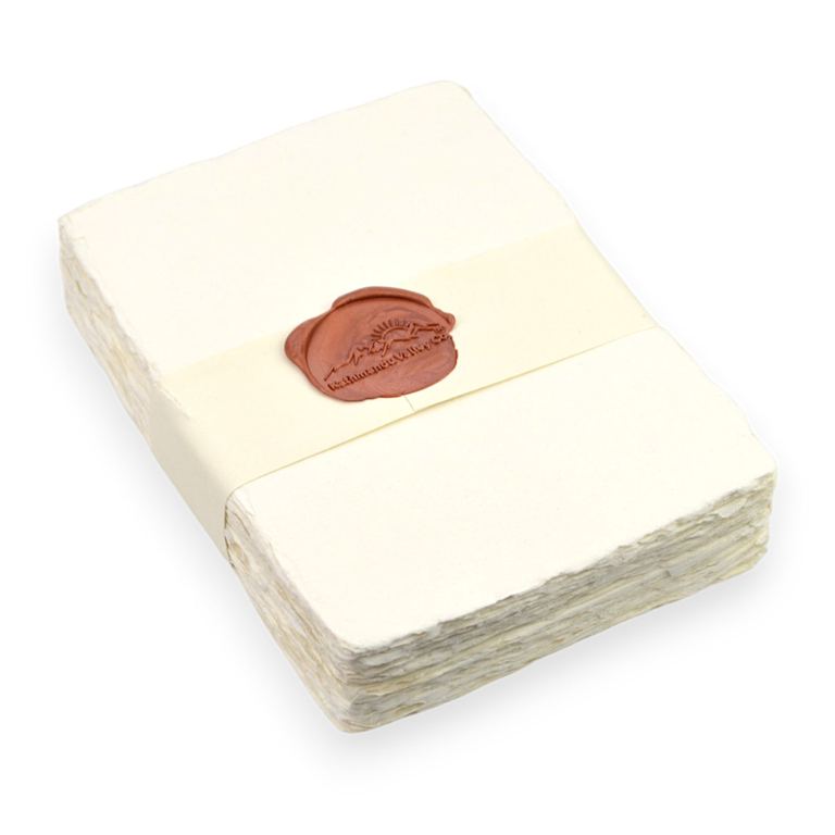5x7 handmade cotton-rag paper, off-white: a banded stack with a wax seal, its deckled edges layered