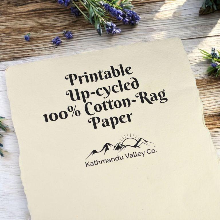 Printable handmade cotton-rag paper: an off-white sheet printed with the words “Printable Up-cycled 100% Cotton-Rag Paper”, lavender behind