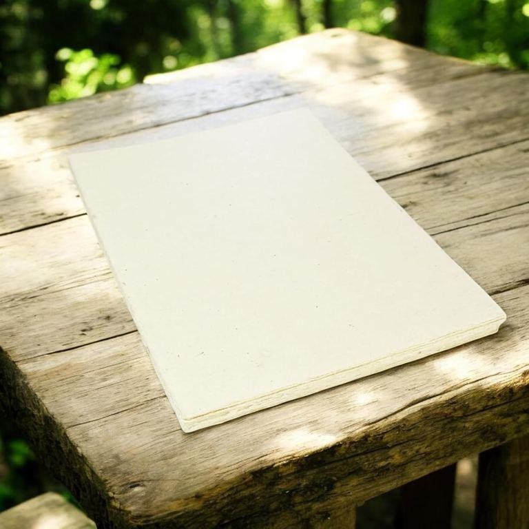 Deluxe lokta card stock on a weathered table in the woods