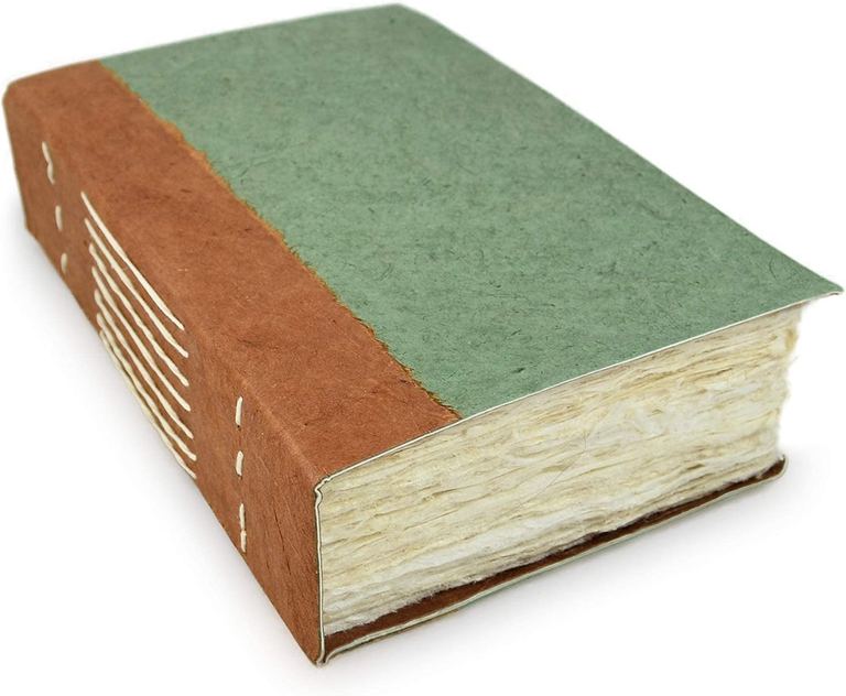 The Sage Nepali Wayfinder journal from the side, showing its thick stack of deckle-edged Epic pages
