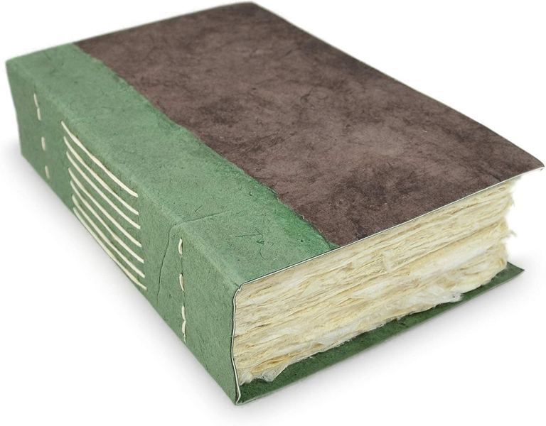 The Walnut Nepali Wayfinder journal, its thick deckle-edged page block and sage spine showing